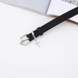 Close-up of black leather belt with silver shield buckle and gothic cross pendant