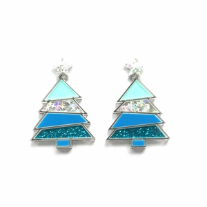 Macro detail of teal and blue glitter Christmas tree earrings with silver star charms