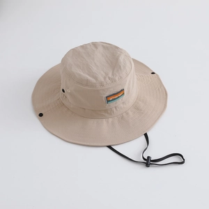 Detail of beige wide brim sun hat with adjustable wind cord and mesh eyelets