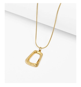 Macro detail of a minimalist golden geometric square pendant on a sleek snake chain