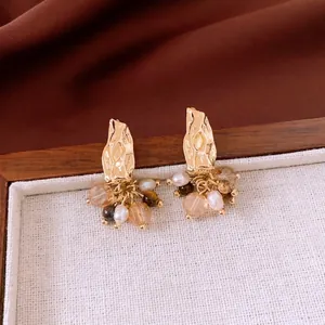 Vintage gold hammer textured earrings with freshwater pearls and crystal tassels