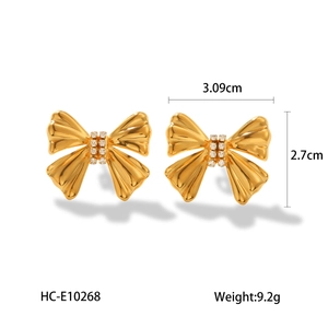 Detail showing dimension and weight of gold bow earrings with sparkling rhinestones