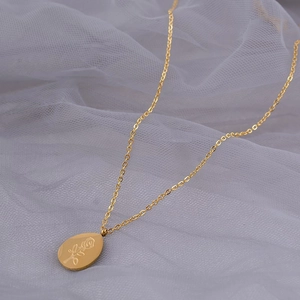 French vintage titanium steel gold necklace with an oval rose patterned drop pendant