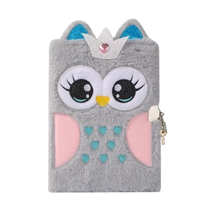 Macro detail of plush gray owl notebook featuring blue sequin ears and metal security lock