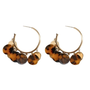 Vintage leopard print tassel earrings with golden hoops in elegant retro aesthetic