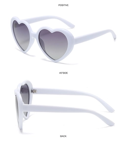 Three-view layout of white heart sunglasses with dark grey gradient lenses