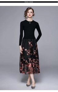 Detail of elegant knit top and intricate floral embroidery on black tulle skirt