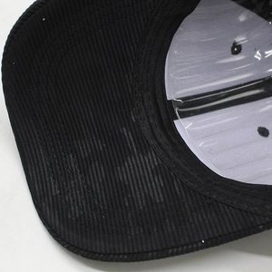 Detail view of the black cotton twill baseball cap with transparent interior support