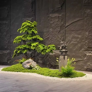 Detailed Zen bonsai with artificial moss, miniature pine tree, stone lion, and white sand