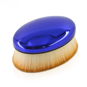 Macro shot of mirror blue foundation brush with dense brown gradient bristles and soft texture