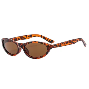 Retro cat-eye sunglasses with leopard print frames and brown lenses on white background