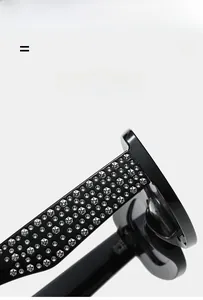 Detail of wide black sunglasses temple with sparkling silver rhinestones and elastic frame