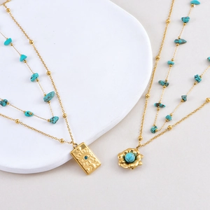 Collana a Doppio Strato in Acciaio al Titanio con Turchese Artificiale e Pendente a Fiore Malocchio in Strass per Donna