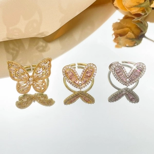 Adjustable butterfly and heart rings with pink and clear zircons on gold and silver bands