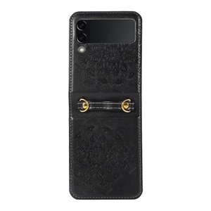 Detail of black leather Samsung Z Flip case with embossed mandala pattern and wrist strap