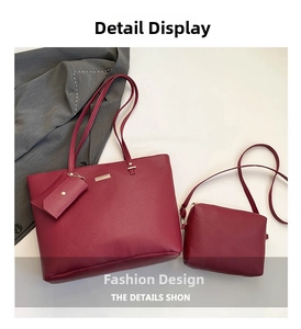 Detailed view of burgundy litchi grain tote bag with card holder and shoulder strap