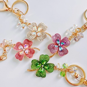 Charming lucky four-leaf clover crystal keychains with colorful rhinestones in gold setting