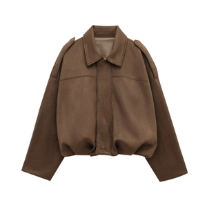 Close-up of brown suede jacket featuring pointed collar and epaulette detail