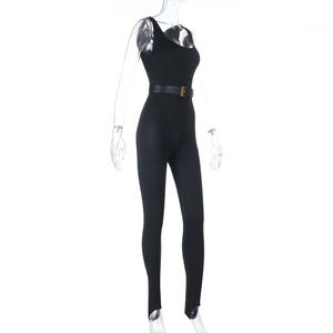 Close-up detail of the black bodysuit with a gold-buckled belt and sleek fabric texture