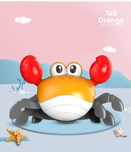 Close-up of a cartoon crab toy with large red claws and eyes on a sea-themed background