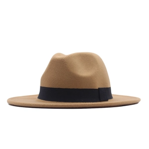 Detail of camel wool felt fedora featuring a crisp texture and elegant black satin ribbon