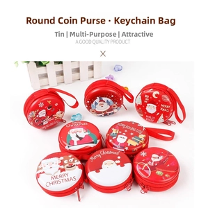 Close-up of festive round tinplate coin purses featuring vibrant Christmas cartoon designs