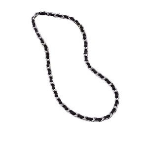 Braided black leather and silver metal chain necklace in a minimalist woven design