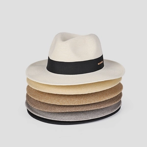 Vertical stack of woven Panama hats in white, beige, and coffee with black ribbons