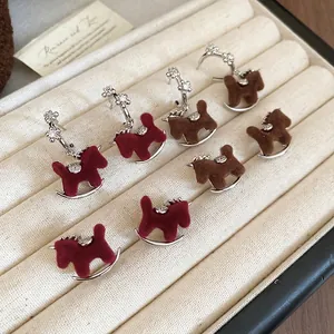 Vintage silver needle rocking horse earrings with flocking texture and zircon details