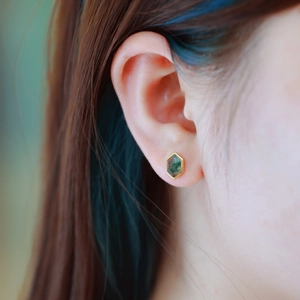 Hexagonal green moss agate stud earrings in gold S925 silver finish worn by a model