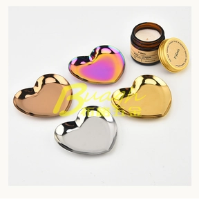 Polished heart-shaped stainless steel trays in silver gold rose gold and rainbow finishes