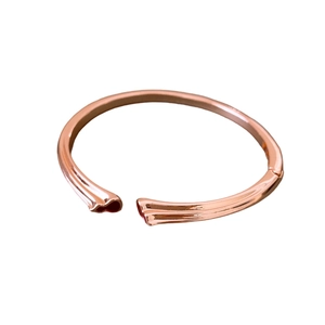 Elegant rose gold bamboo joint open bangle with a minimalist polished metal texture