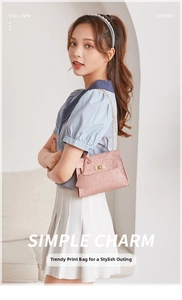 Detailed view of pink chain bag with embossed love heart patterns and gold lock