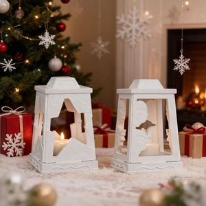 Detail of white hollow Christmas lantern silicone molds with Santa and star patterns