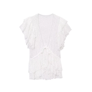 Gilet court en dentelle blanche avec bords à volants et détails de nœuds