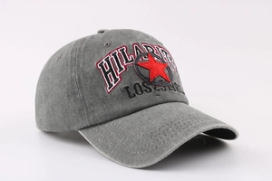 Detail of grey washed cotton baseball cap with red star and Hilarity embroidery