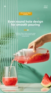 Action shot of pouring cocktail from 700ml graduated shaker into a glass with fruit