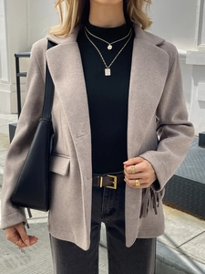 Elegant beige vintage long-sleeved jacket with fringe detail and lapel collar for women