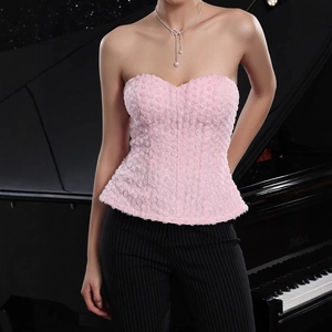 Detail of pink corset top featuring 3D floral texture and strapless slim-fit cut