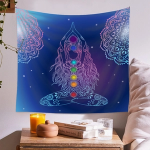 Detail of meditation tapestry with 7 chakras and mandala on starry sky background