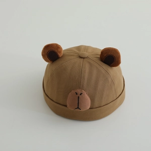 Detail showing plush ears and embroidered bear face on beige cotton docker hat