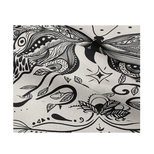 Close-up of black and white butterfly print on soft fabric wall tapestry texture