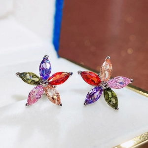 Macro shot of colorful five-petal flower earrings with multi-color marquise stones