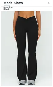 Detail of high waisted flared yoga pants featuring V-shaped pleated waist in premium black