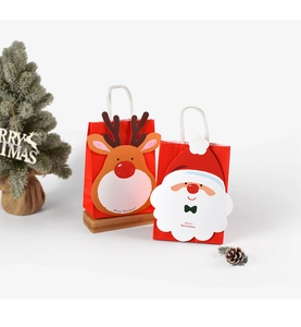 Detail of red Christmas paper gift bags with 3D cartoon Santa and reindeer characters