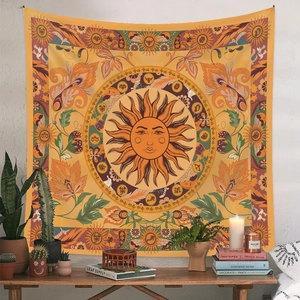Close-up of bohemian moon phase tapestry with sun and celestial astrology patterns