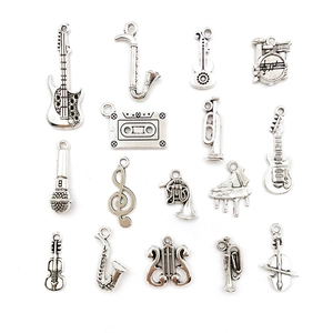 Selection of silver musical instrument charms including guitar, saxophone and violin