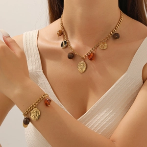 Vintage gold plated coin pendant necklace and bracelet set with amber resin beads