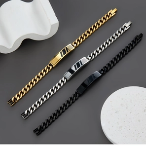 Three Cuban chain bracelets in gold, silver and black with striped rectangular plates