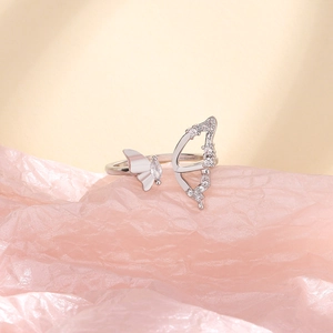 Detail of adjustable silver butterfly ring with marquise and round zircon stones